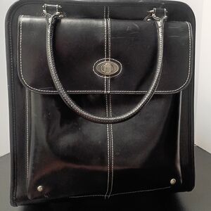 Wilsons Leather Black Travel Bag With Zippered Pull Out Handle And Wheels